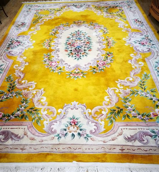 A Chinese gold ground medallion carpet 375 x 275cm